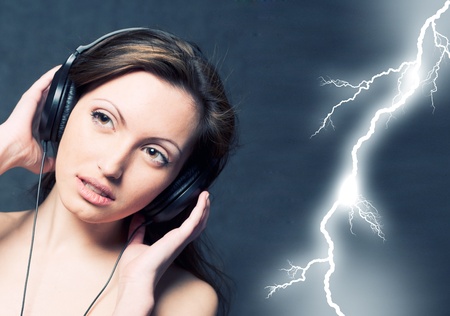 Sexy woman with headphones listening to music