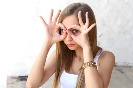 Young blonde woman making funny faces closeup