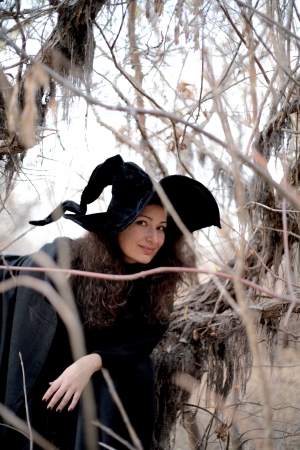 Shot of a gothic woman in a autumn park. Halloween.