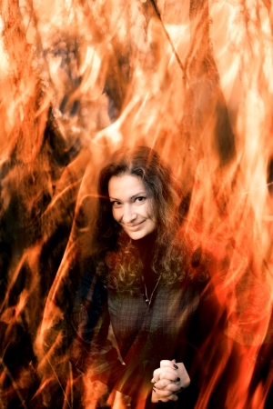 Sexy  girl in witch costume for Halloween in a forestの写真素材