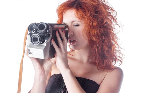 Portrait of a beautiful woman with the vintage camera