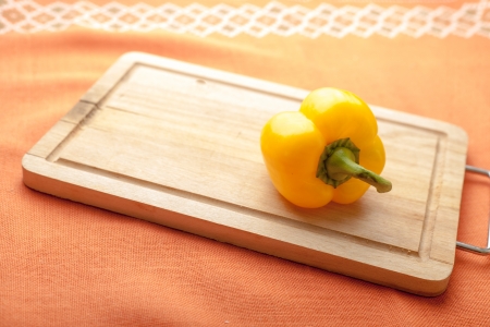 Yellow pepper -Fresh Organic Vegetables on a Wooden Backgroundの写真素材