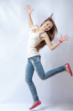young sexy blond woman in casual outfit isolated on white dance exercise fitnessの写真素材