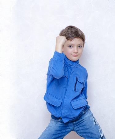happy smiling five-year-old boy on white backgroundの写真素材
