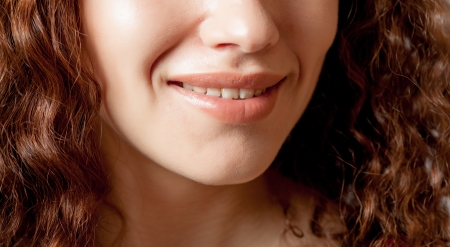 Close up shoot of young beautiful girl with perfect skin  makeup mouth zone  Smiling Lips の写真素材