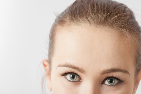 Half face Beautiful caucasian woman portrait on white backgroundの写真素材