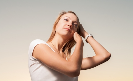 blonde 20s women head and shoulders outdoor against skyの写真素材