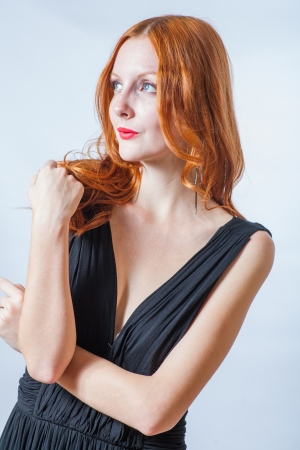 redhead in studio, looking awayの写真素材