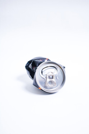 crushed empty can on white