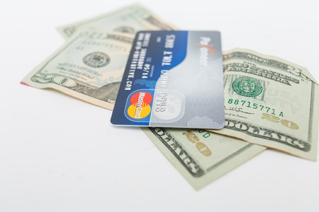 Astrakhan, Russia - January 24, 2014  Closeup of Payoneer MasterCard credit card on dollar cash  Mastercard is one of the biggest credit card companies in the world のeditorial素材
