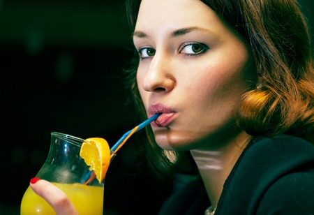 women drinking cocktail colorized imageの写真素材