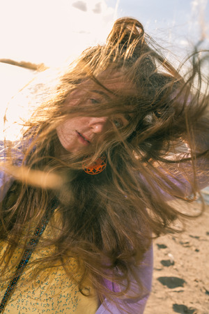 Long haired blonde outdoors on blowing windの写真素材