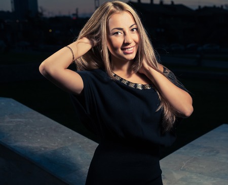 Blonde posing in a vening timeの写真素材