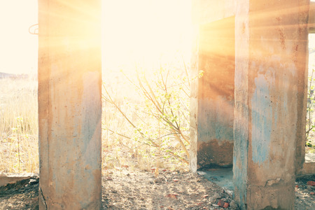 Sun in door of demolished building の写真素材