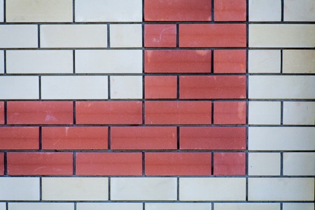 Brick wall background. Red and white bricks,  a lot of copyspace. Wall of a modern building as backdropの写真素材