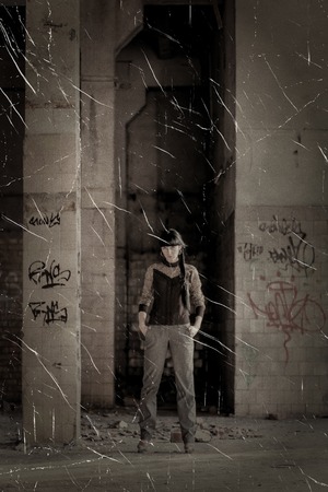 FAshon women posing in slums sunlit sepia toned image.の写真素材