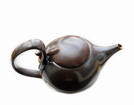 China teapot of brown color isolated on whiteの写真素材