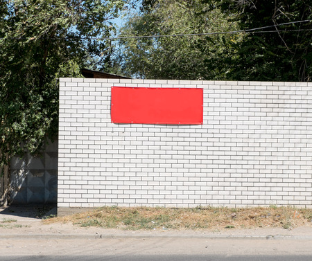 White brick wall background with red bannerの写真素材