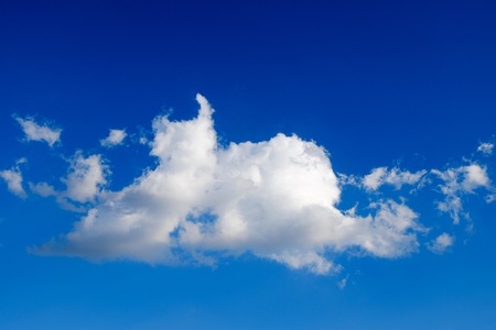 Deep blue sky with cloudの写真素材