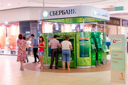 ASTRAKHAN, RUSSIA - AUG 16, 2014: ATM Stand of Sberbank of Russia in lokal retail store. Sberbank is the lagest bank in Russia.のeditorial素材