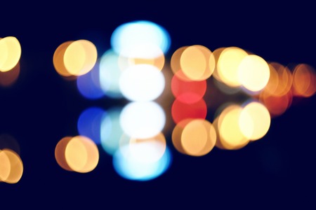 Night city out-of-focus image. Carlights on the road defocused wallpaper.の写真素材