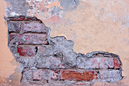 Cracked concrete vintage brick wall backgroundの写真素材