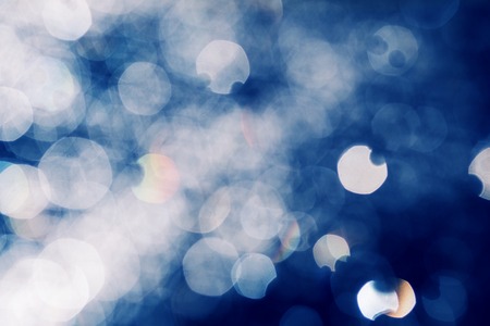 Stylized abstract background blue bokeh mixed circles.の写真素材