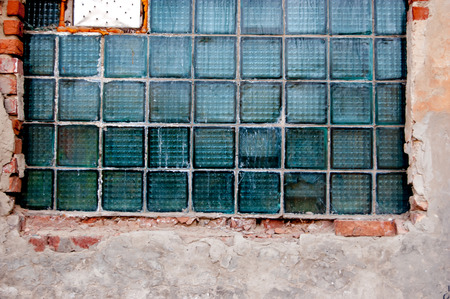 Tiled industrial window in abandoned urban place.の写真素材