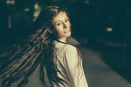 Colorized image of long haired women shaking her beautiful hair.の写真素材