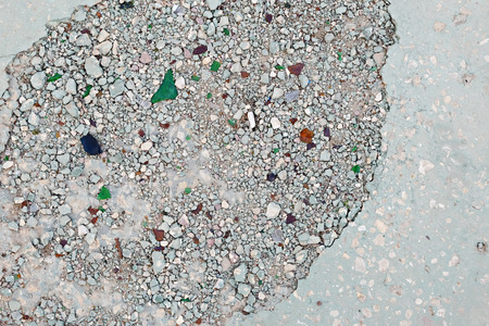 Broken cement pavement. Destroyed road surface, hole in asphalt.の写真素材