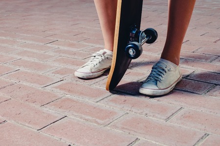 Sporty legs and skateboardの写真素材