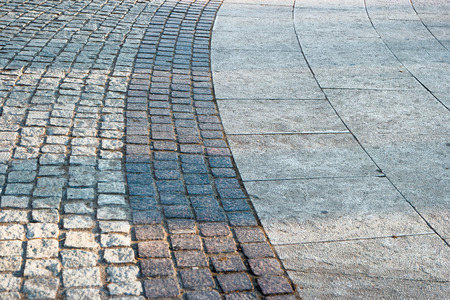 Bended paved footpath a lot of space for textの写真素材