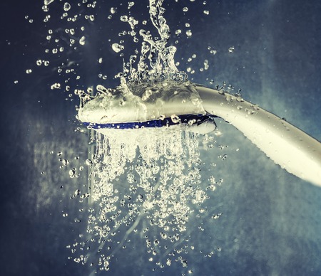Shower head with levitating water dropsの写真素材