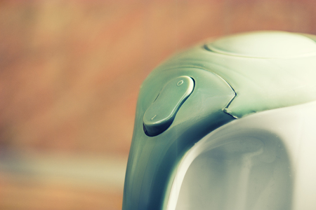 Hot water maker button toned imageの写真素材