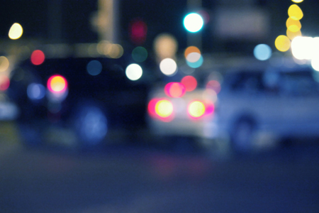 Blurred urban night scene defocused cars in the street.の写真素材