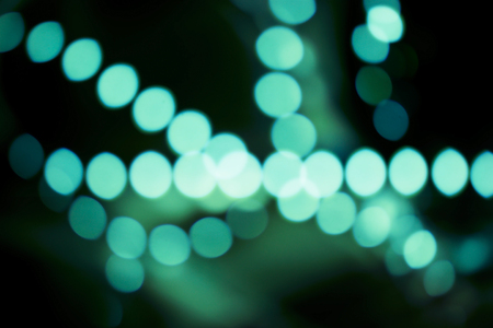 Green bokeh lights decoration on dark backgroundの写真素材
