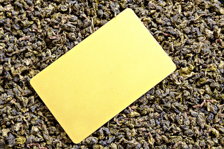 Oolong tea background and blank golden color card for text, copyspace.の写真素材