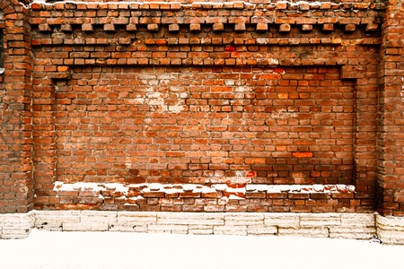 Abandoned building wall made of red bricks, artificial frame for text.の写真素材