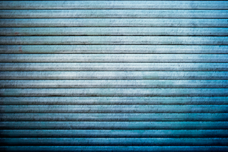 Obsolete planks painted in blue color background.