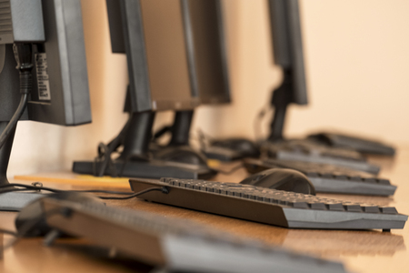 Workstations. Workplace room with computers from low angle.の写真素材