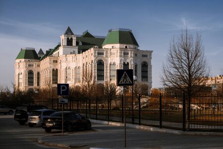 Astrakhan, Russia 12 of April 2018: New Astrakhan Opera Theater In Sunny Spring Day With Cars Parked About. Angle View.のeditorial素材