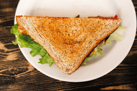 Top view of triangle clubhouse sandwich on plateの写真素材