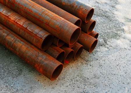 Replacement of Pipes. Set Of Water Pipes Ready For Installation Lying On Groundの写真素材