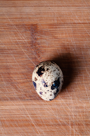 Top View Small quail egg on wooden board, a lot of copyspaceの写真素材