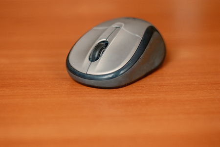 Wireless computer mouse on a table, copyspace