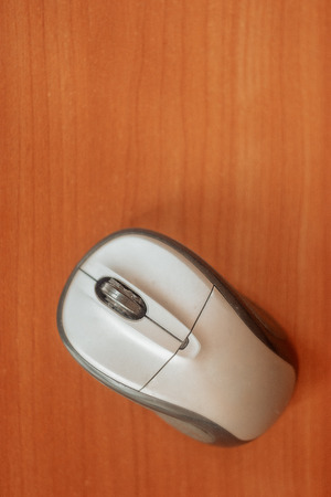 Wireless computer mouse on a table top view, copyspace