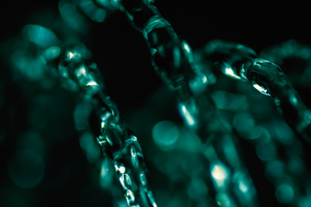 Selective focus water drops in air in emereld green colorの写真素材