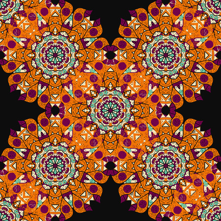 Seamless mandalatiled pattern in orange color over black background. Floral indian vector. Ornate arabic ottoman indian motif.のイラスト素材
