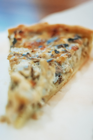 Homemade-style meat pie on paper macro view selective focusの写真素材