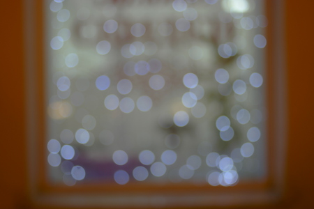 Store window with defocused garland lightsの写真素材
